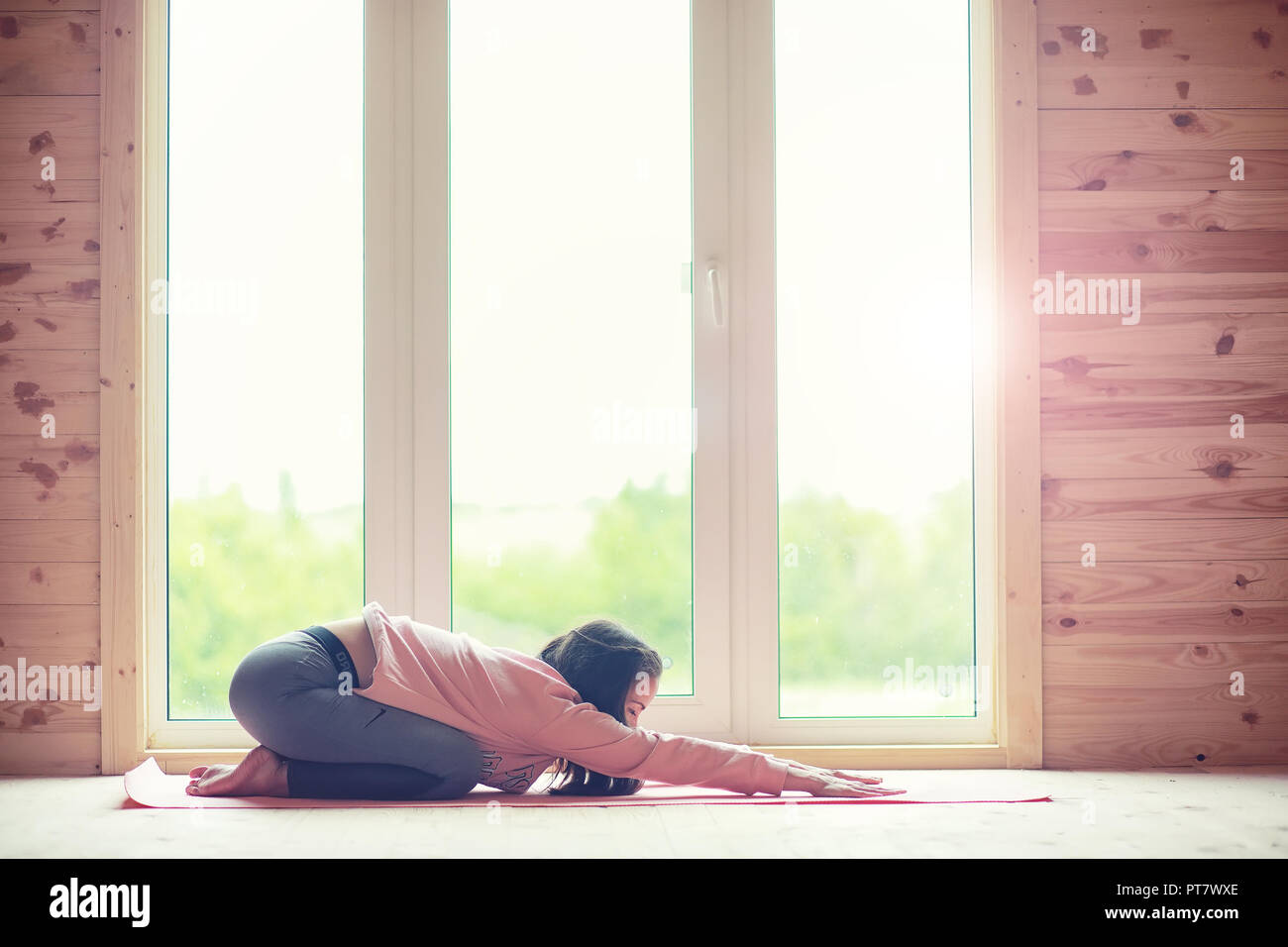 Girl In Yoga Poses On The Floor Stock Photo 221450166 Alamy