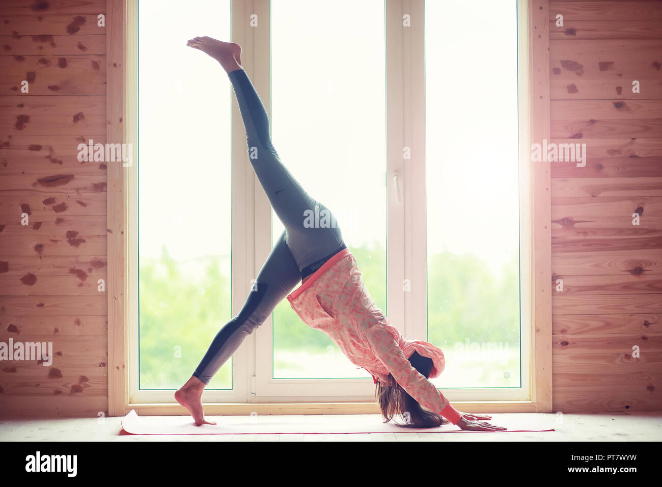 Girl In Yoga Poses On The Floor Stock Photo 221450205 Alamy