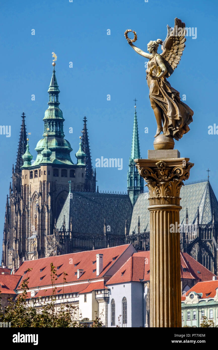 View of Prague Castle Cathedral St Vitus Hradcany building Female angel figure on a column, Prague Cathedral day Prague angel on column Stock Photo