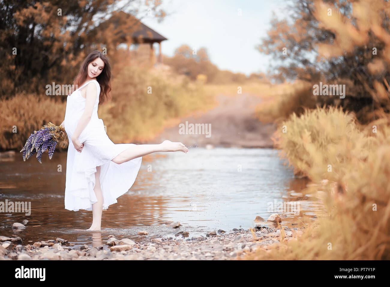 Pregnant woman in nature for a walk in the autumn Stock Photo - Alamy