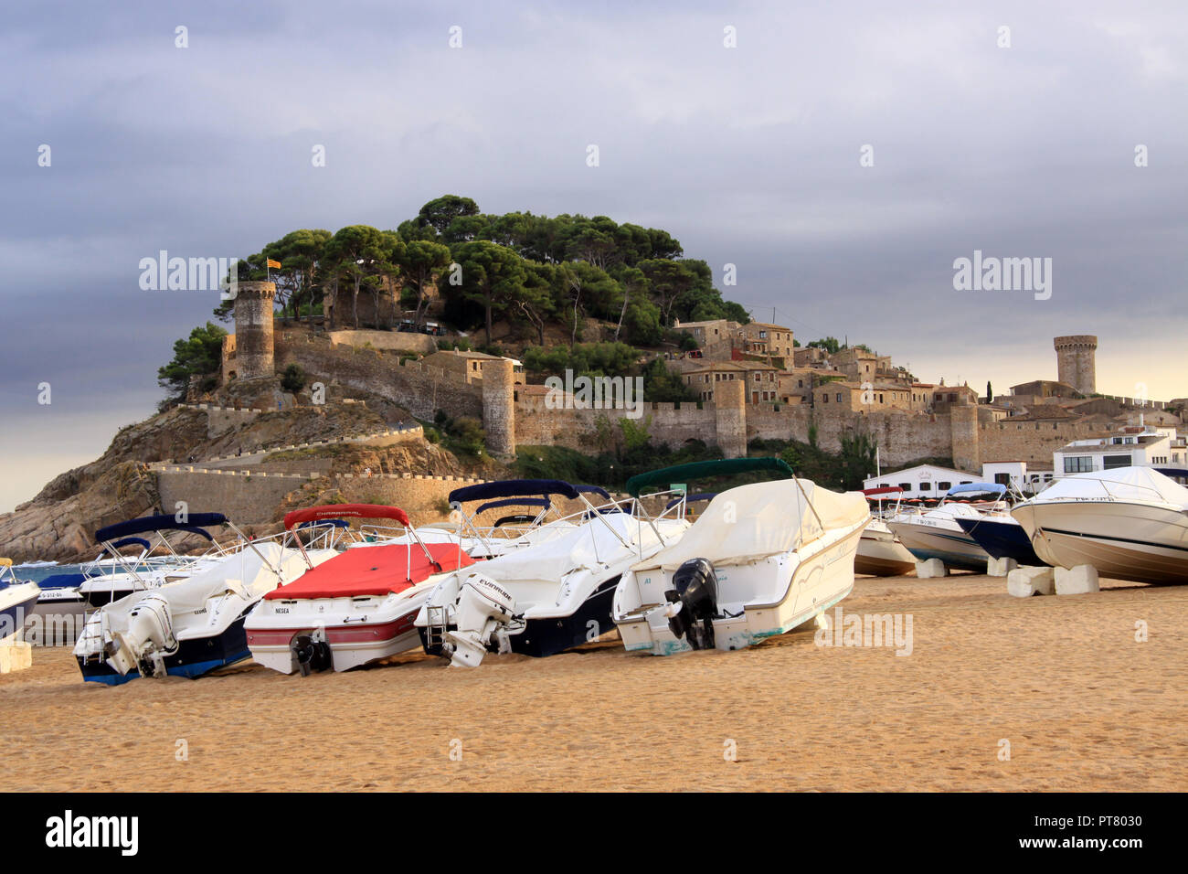 Sandy beach and castle at the Spanish seaside coastal resort of Tossa de Mar Spain on the Costa
