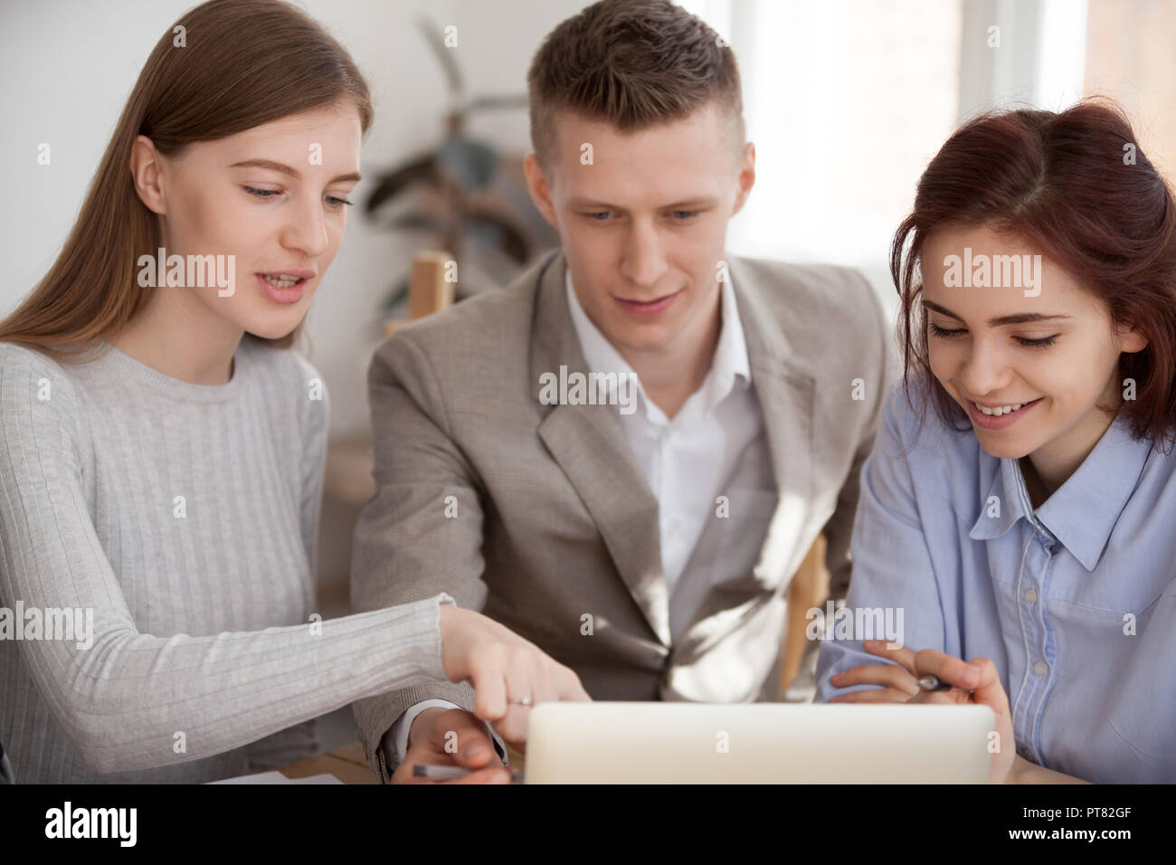 Colleagues talking discussing about project in office Stock Photo