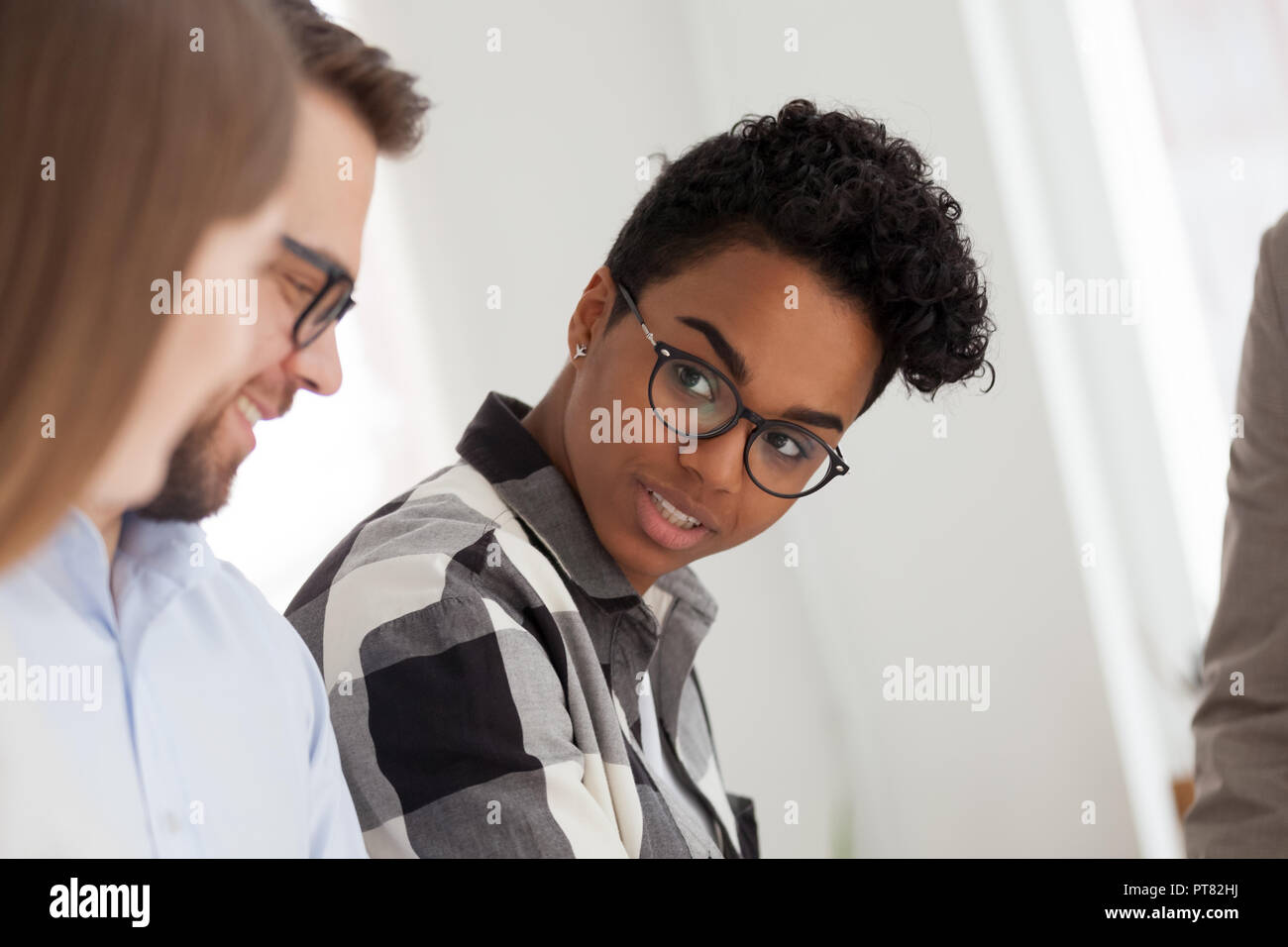 Multiracial business people in office at meeting Stock Photo - Alamy