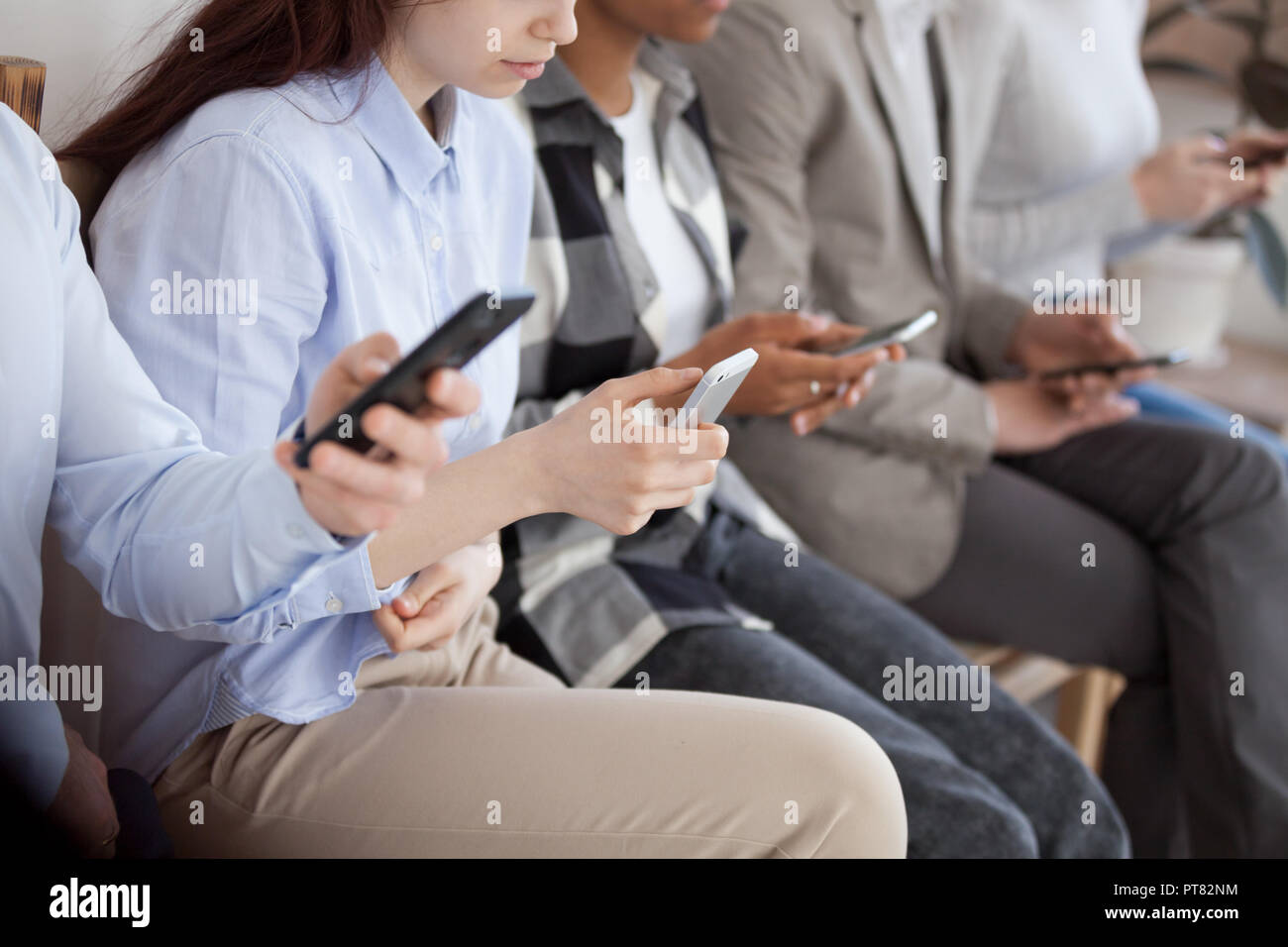 Candidates sitting in chair in queue wait job interview Stock Photo