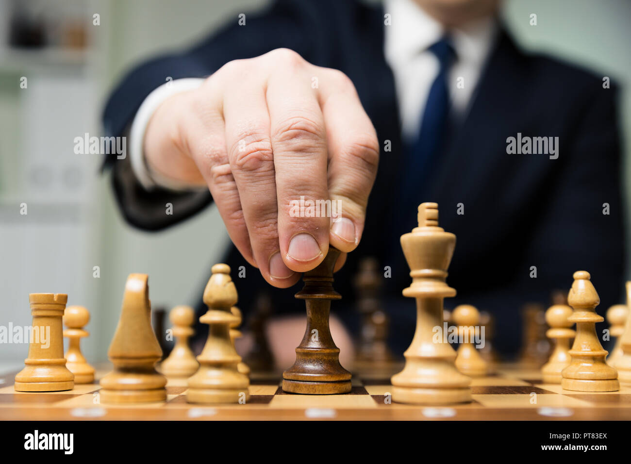 Children's Restraining Hand Thoughtfully Figure Before The Next Chess Move  Stock Photo, Picture and Royalty Free Image. Image 77247675.