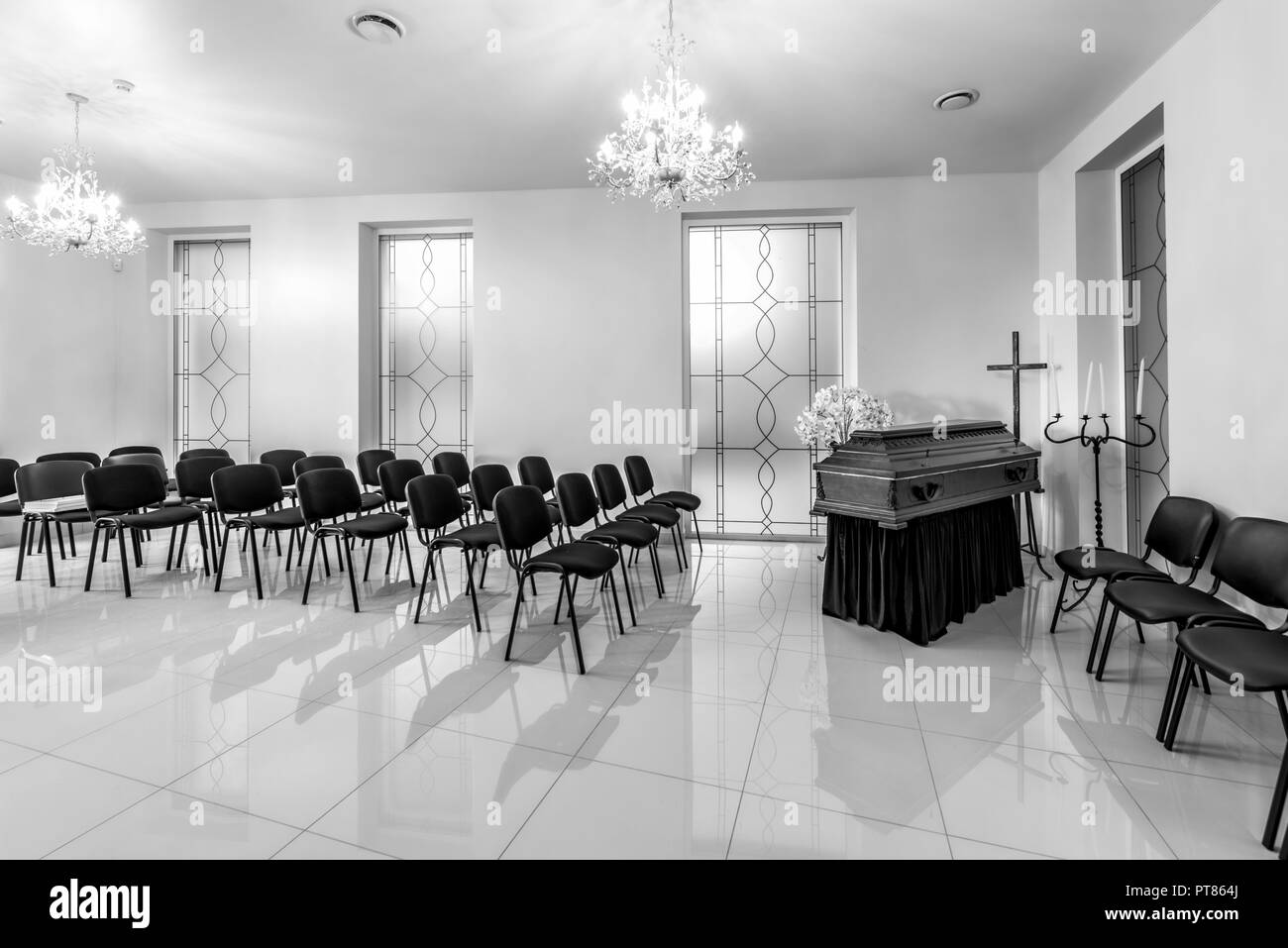 Black and white interior of the funeral home with coffin Stock Photo