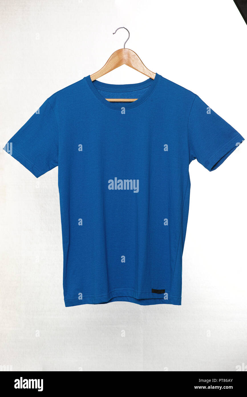 Download Blank Blue T Shirts Mock Up Hanging On White Background Isolated With Clipping Path On Tshirt Front View Ready To Replace Logo Design Stock Photo Alamy