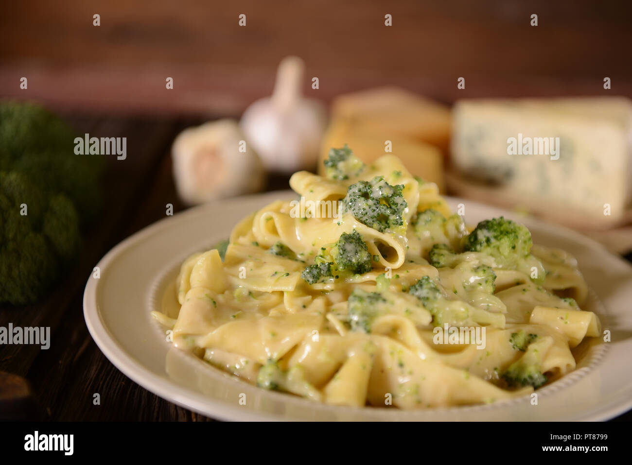Pappardelle pasta with four cheese sauce and broccoli Stock Photo Alamy