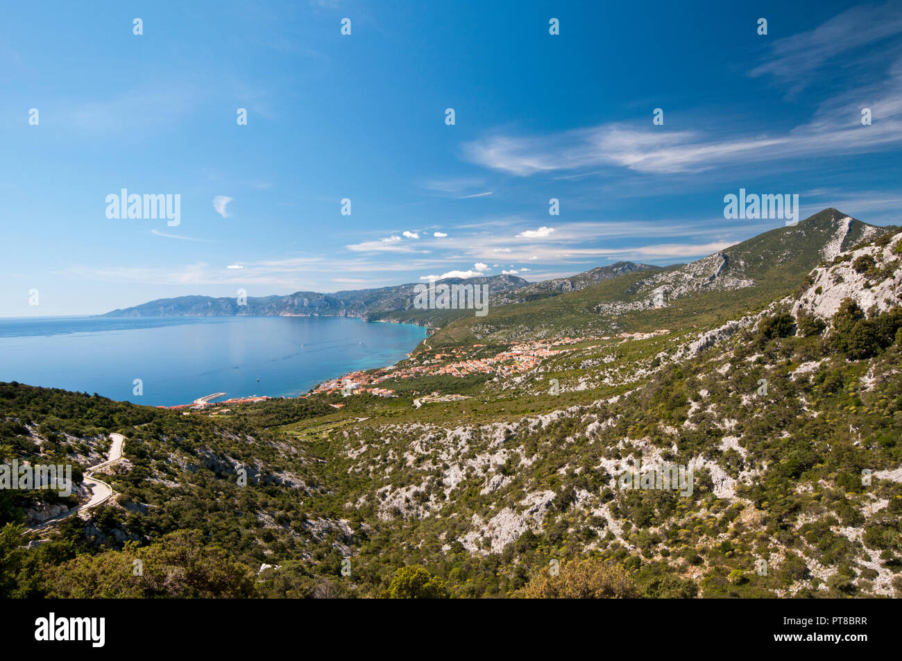 Cala Gonone town with Supramonte mountains in the foreground, Dorgali, Sardinia, Italy Stock Photo
