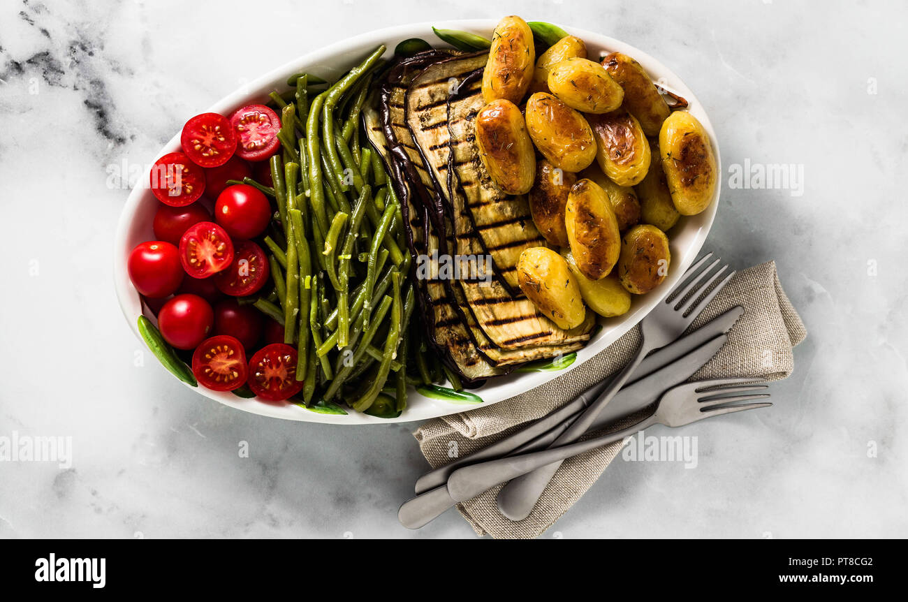 https://c8.alamy.com/comp/PT8CG2/banner-of-a-side-dish-of-vegetables-on-the-holiday-table-healthy-food-for-the-whole-family-or-dinner-at-a-restaurant-on-a-white-marble-table-baked-p-PT8CG2.jpg