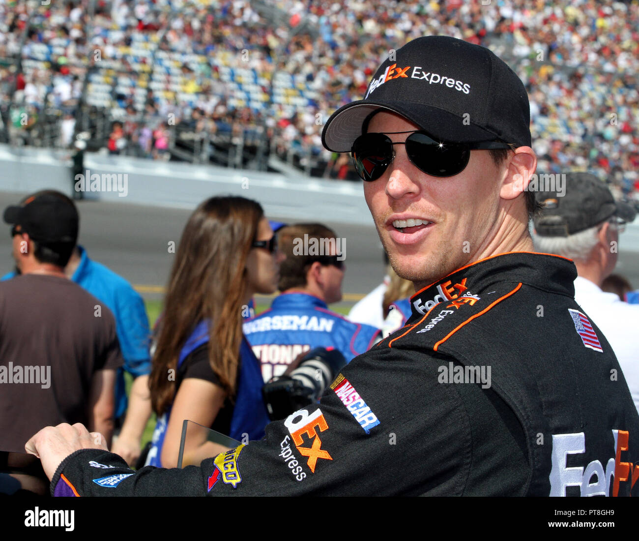 Denny Hamlin waits on pit road for the start of the NASCAR Sprint Cup Budweiser Duel #1, at Daytona International Speedway in Daytona, Florida on February 21, 2013. Stock Photo