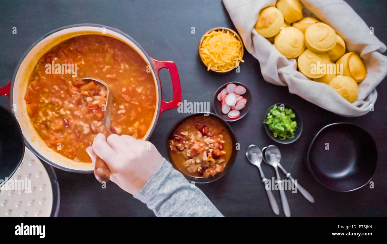Step by step. Top view. Serving turkey chili from enameled cast iron