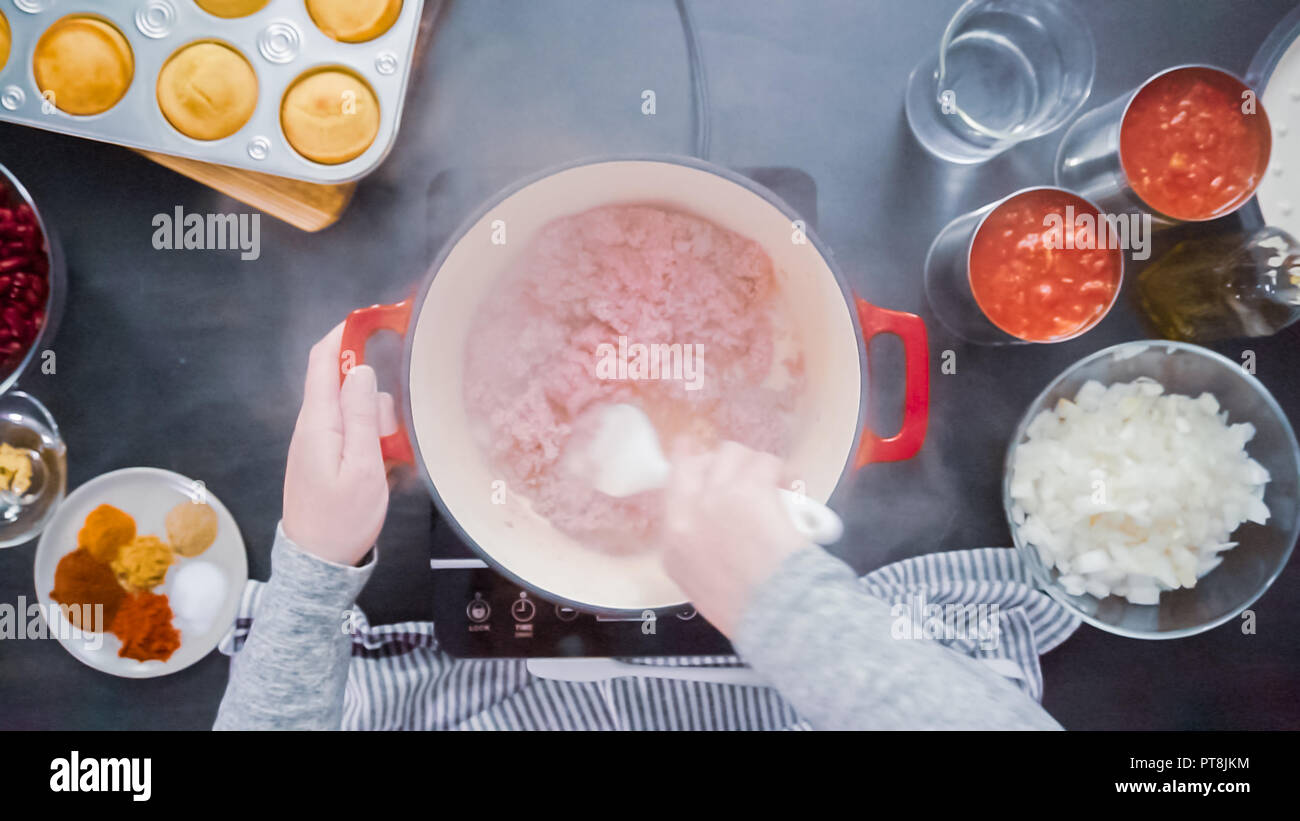 Step by step. Top view. Cooking turkey chili in enameled cast iron
