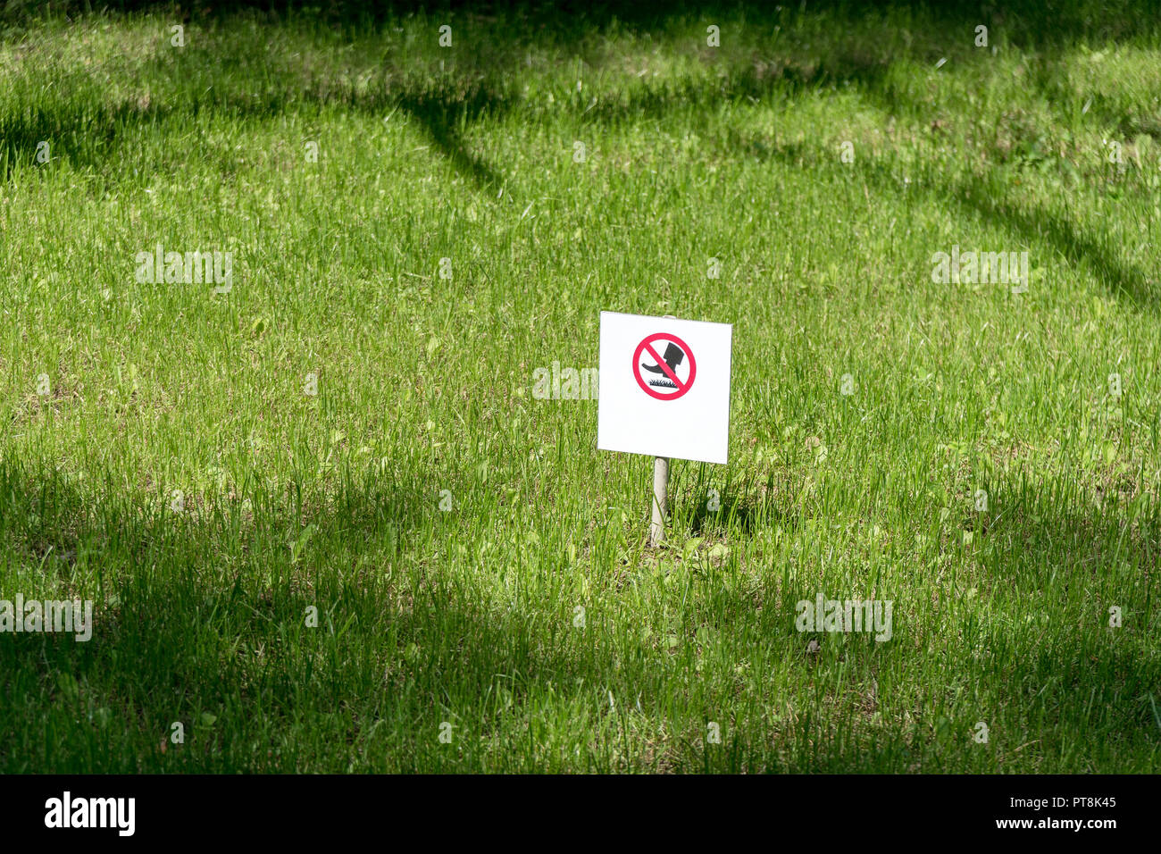 the symbol or sign of a ban is established in park and means the warning information that on lawns not to go. Stock Photo