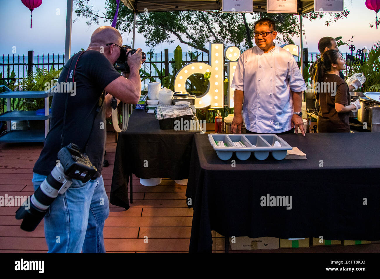 Jimmy Shu attracts attention everywhere in Darwin. Jimmy Shu, who owns the famous Hanuman Restaurant in Darwin, Australia at the deckchair cinema in Darwin Stock Photo