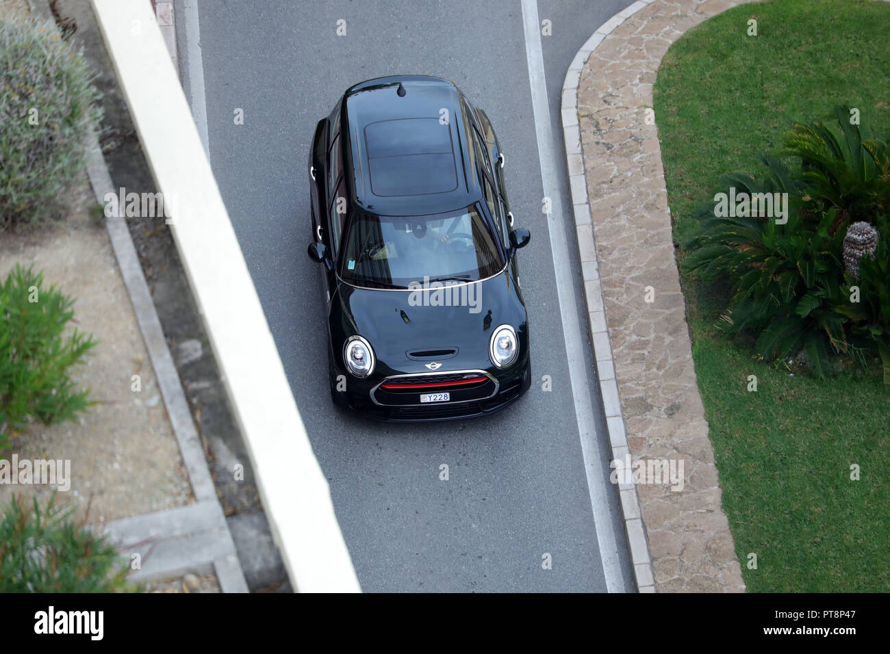 Monte-Carlo, Monaco - October 5 2018 : Aerial View Of A Beautiful Black MINI John Cooper Works (Top View) Driving On The Boulevard Du Larvotto In Mona Stock Photo