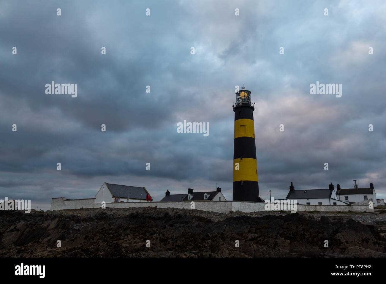 Lighthouse lit in evening at St Johns Point, County Down, N.Ireland. Stock Photo