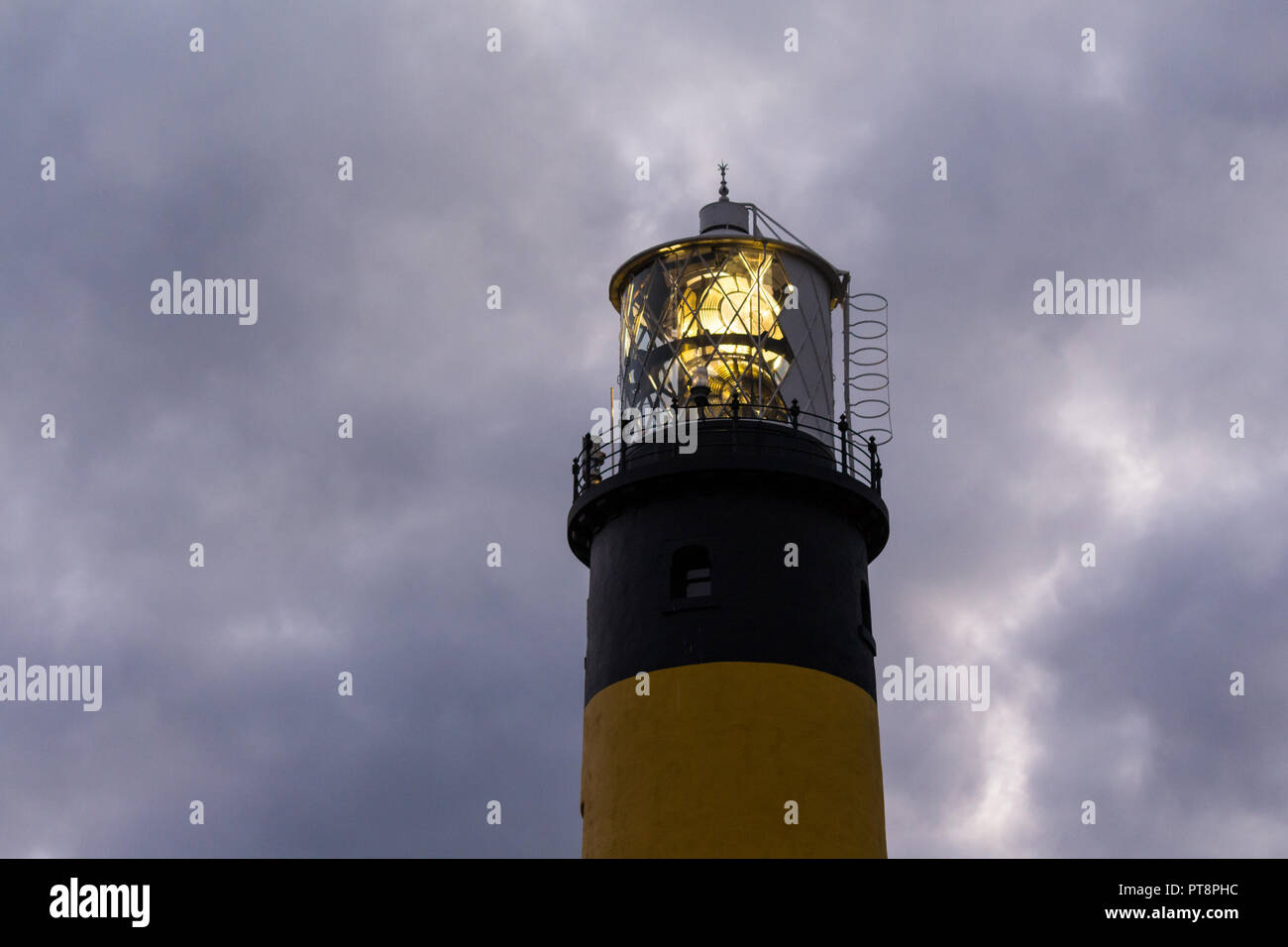 Top of lighthouse shining light at St Johns Point, County Down, N.Ireland. Stock Photo