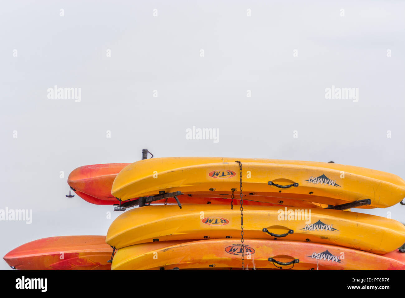 Stacked sea kayaks Stock Photo