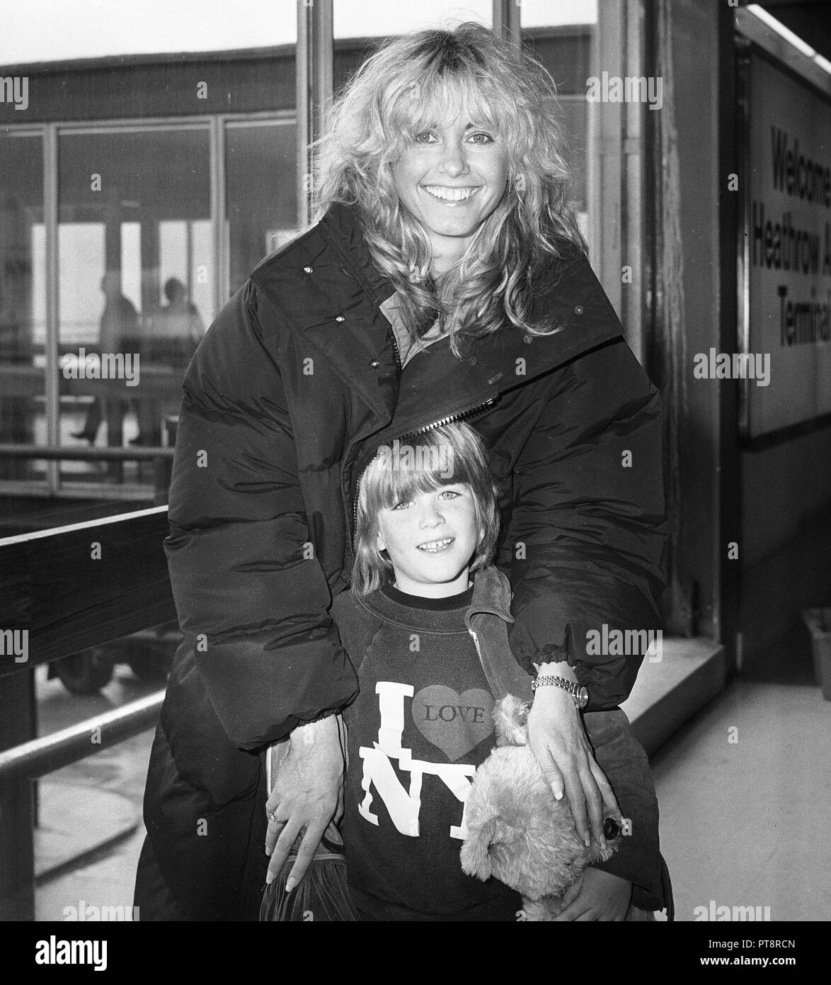 Singer, actress Olivia Newton John arriving at Heathrow Airport from Los Angeles with nephew Emerson in April 1980. Stock Photo