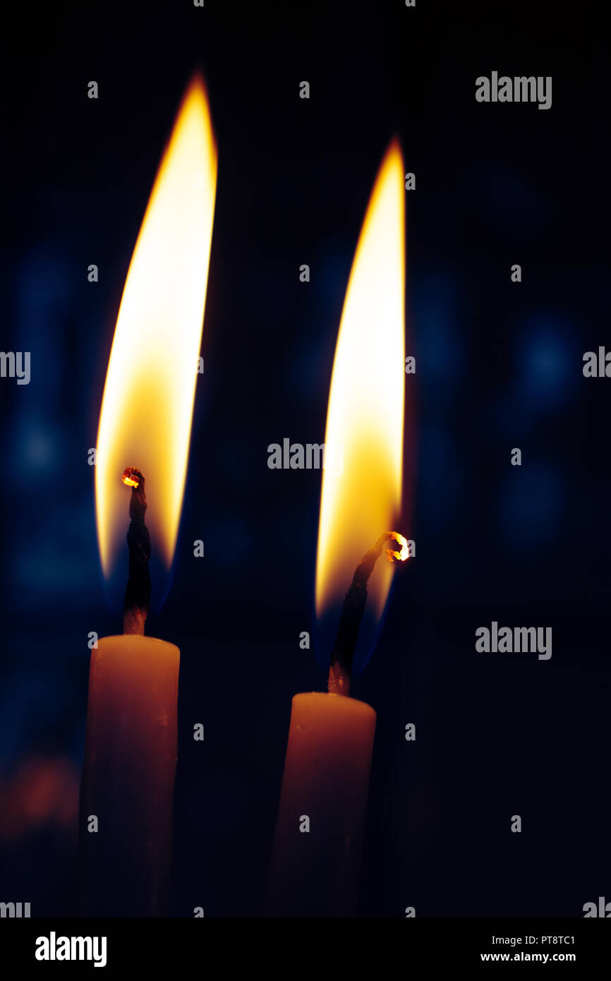 Candles burning in the dark with flame Stock Photo Alamy