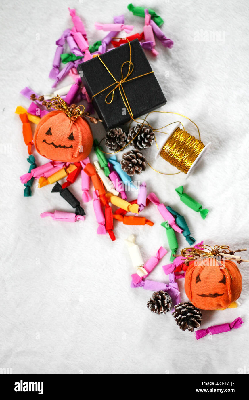 Simple handmade jack o lantern decorations and colorful candy for trick or treat during halloween Stock Photo