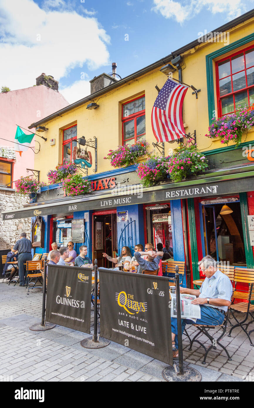 GALWAY, IRELAND AUGUST 18, 2012 Men relaxing on a summer's day at The Quays bar in Shop