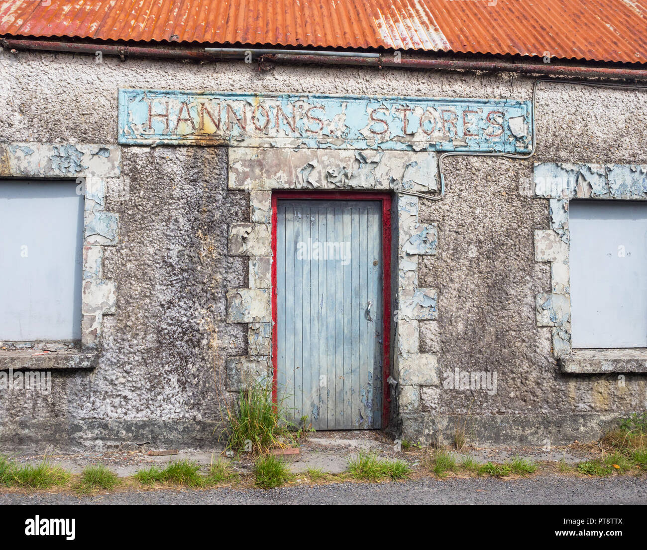 HEADFORD, IRELAND - AUGUST 8, 2018: The abandoned Hannon's Stores building next to a country road near Headford, in County Galway, Ireland. Stock Photo