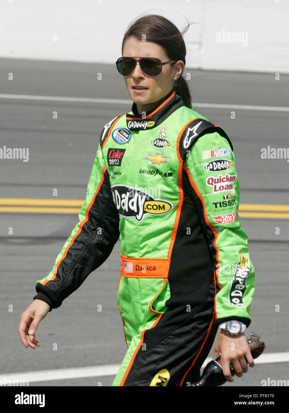 Danica Patrick walks to her car on pit road prior to the start of the NASCAR Nationwide Series DRIVE4COPD 300, at Daytona International Speedway in Daytona, Florida on February 23, 2013. Stock Photo