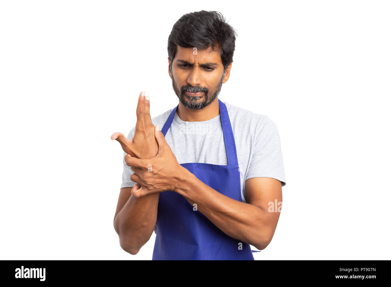 Hypermarket or supermarket indian male employee touching painful wrist as injured concept isolated on white background Stock Photo