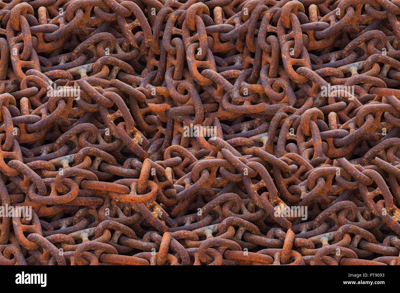 Abstract background with links of marine chain covered with rust close-up Stock Photo