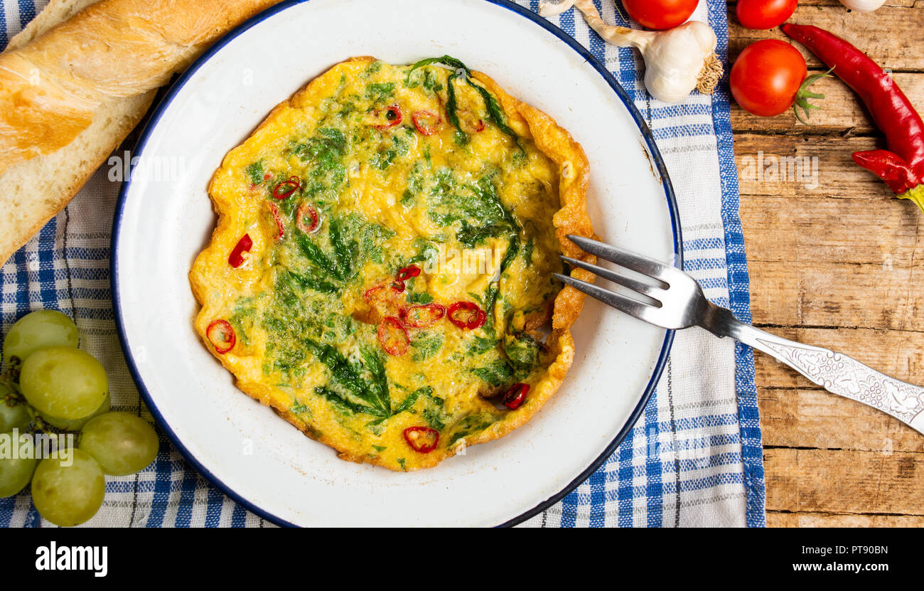 Egg omelet with marijuana leafs on a plate top view Stock Photo