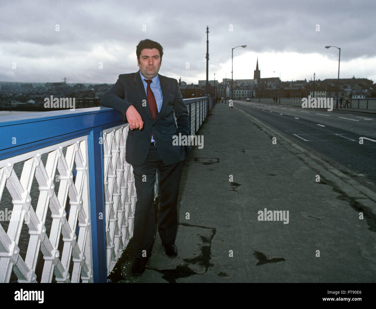 John Hume, Irish politician standing in front of Derry, Londonderry, Northern Ireland. Former leader of the Social Democratic and Labour Party of Northern Ireland. Served as a Member of the European Parliament and a Member of the UK Parliament, as well as a member of the Northern Ireland Assembly. Co-recipient of the 1998 Nobel Peace Prize, with David Trimble.1980s Stock Photo