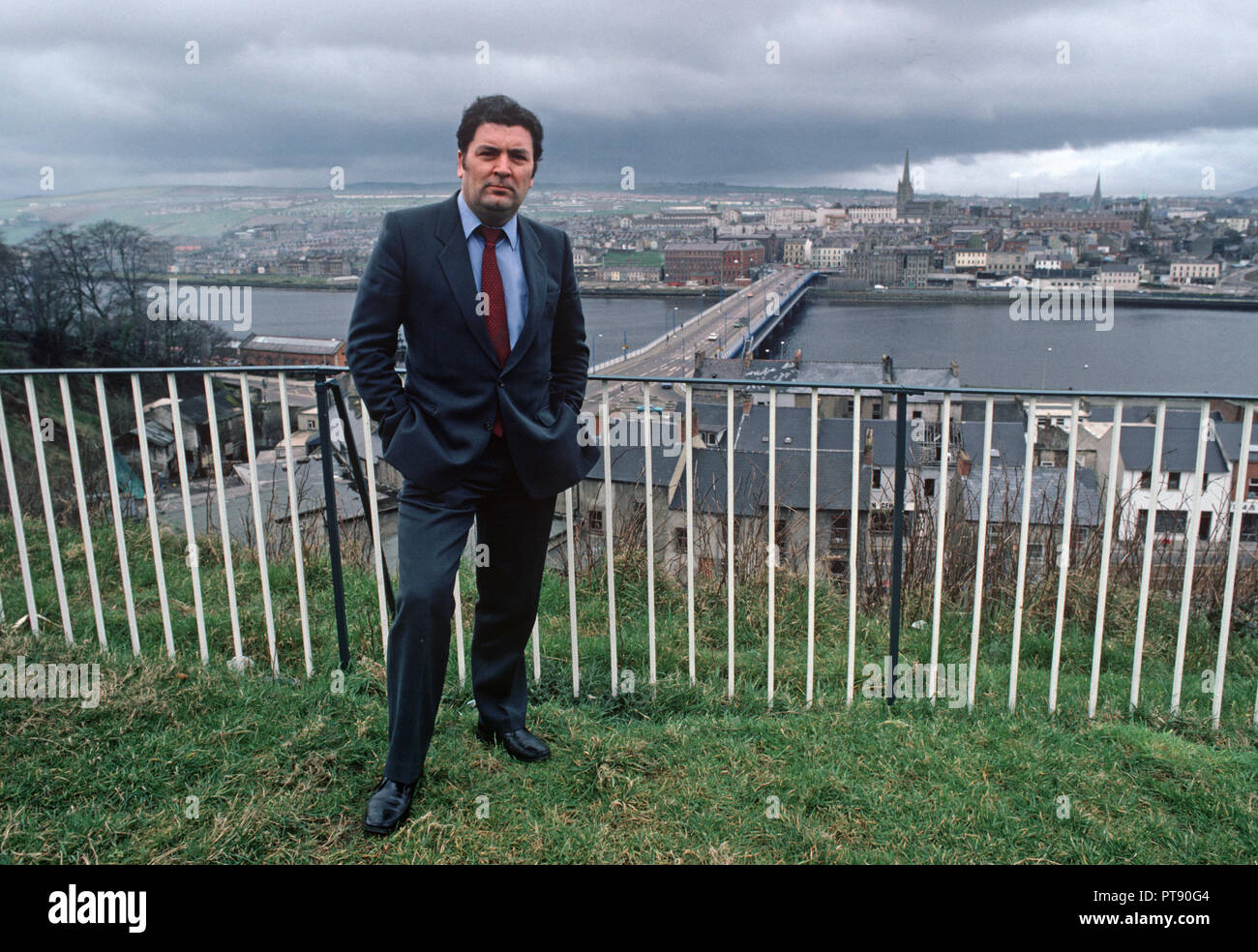 John Hume, Irish politician standing in front of Derry, Londonderry, Northern Ireland. Former leader of the Social Democratic and Labour Party of Northern Ireland. Served as a Member of the European Parliament and a Member of the UK Parliament, as well as a member of the Northern Ireland Assembly. Co-recipient of the 1998 Nobel Peace Prize, with David Trimble. 1980s Stock Photo