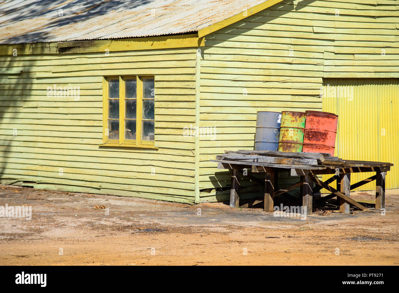 green house with colourful barrels in front of it. Eastern Wheatbelt region, Lake Grace, Western Australia, Australia Stock Photo