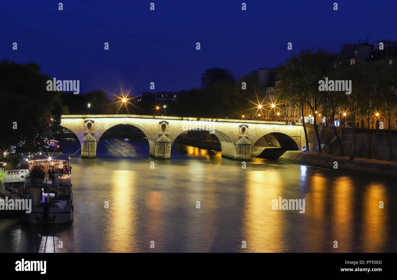 Marie Bridge, between Saint Louis Island and the Quai des Celestins. View from the river Seine at night, Paris. Stock Photo