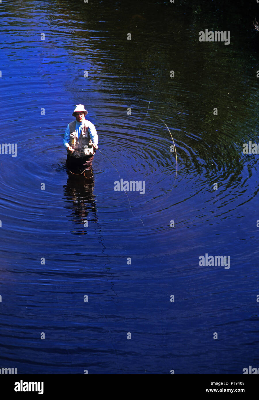 A flyfisherman in the Blackstone River in Massachusetts, USA Stock Photo