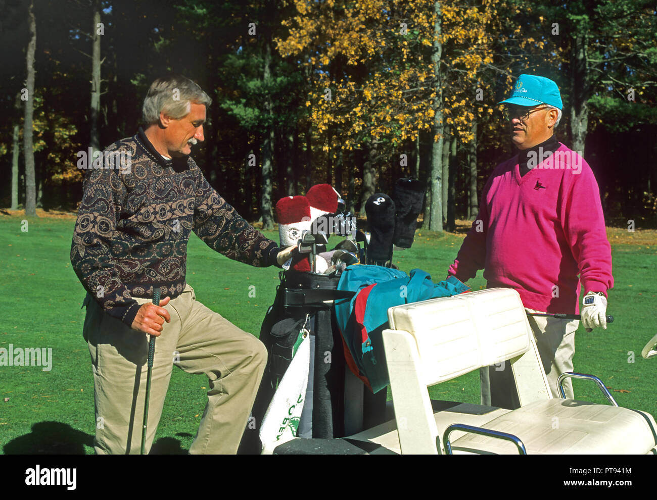 Two golfers on the course in a business discussion Stock Photo
