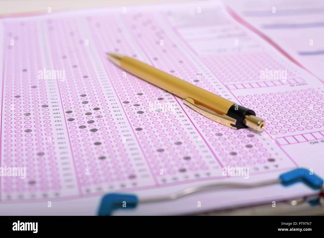 Picture of pen on the OMR sheet and OMR sheet on the clipboard Stock