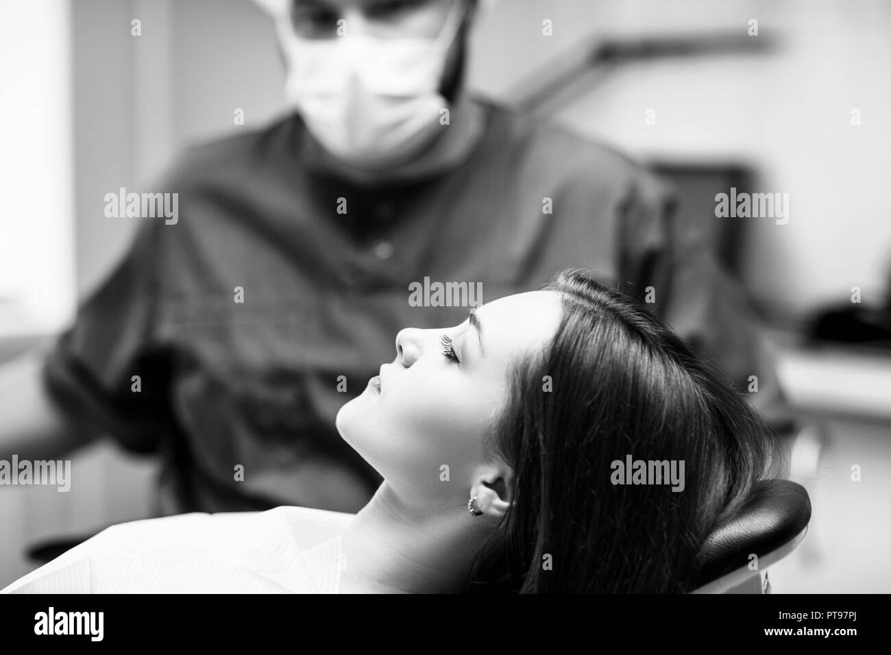 Young woman patient waiting treatment in stomatology clinic. Stock Photo