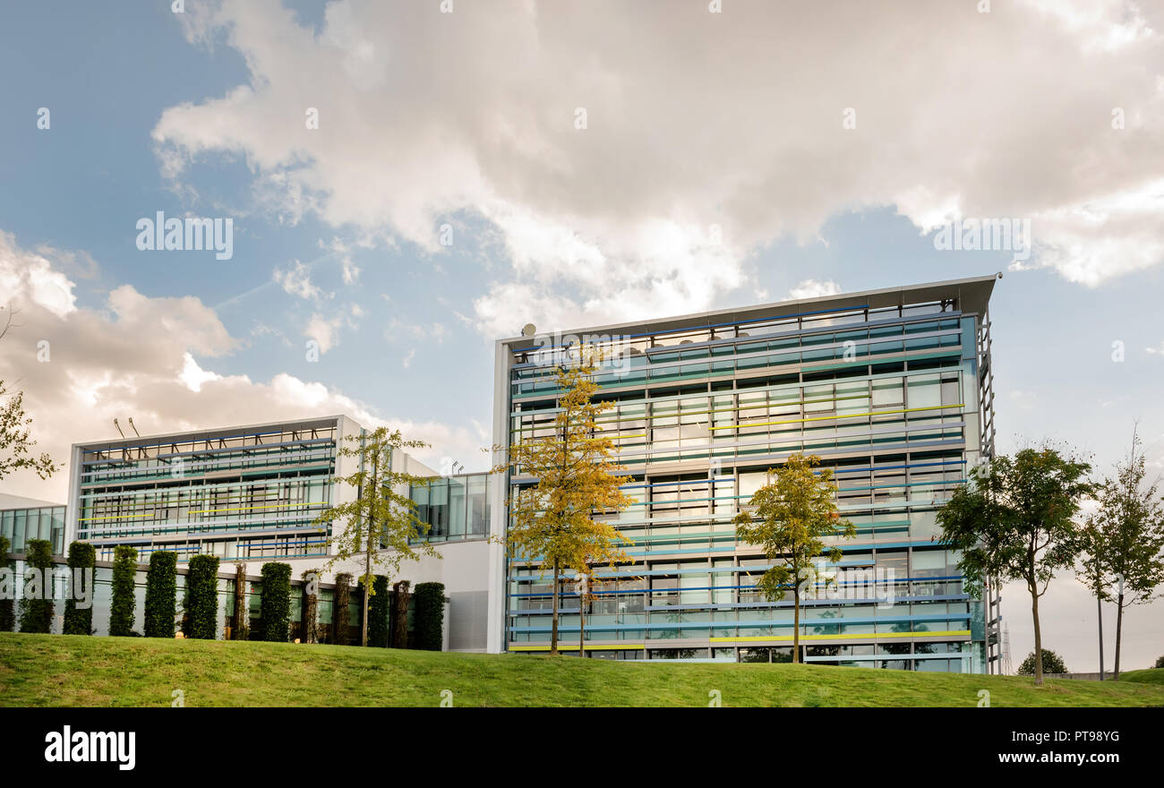 Scenic view of large office building with landscaped gardens. Stock Photo
