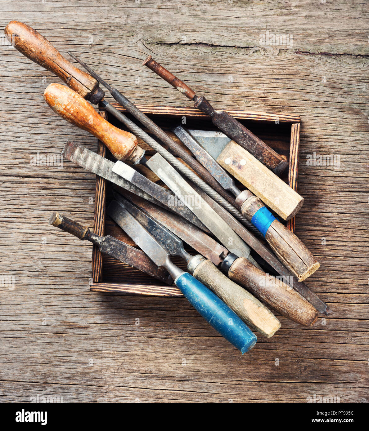 Old vintage hand tools on wooden background Stock Photo