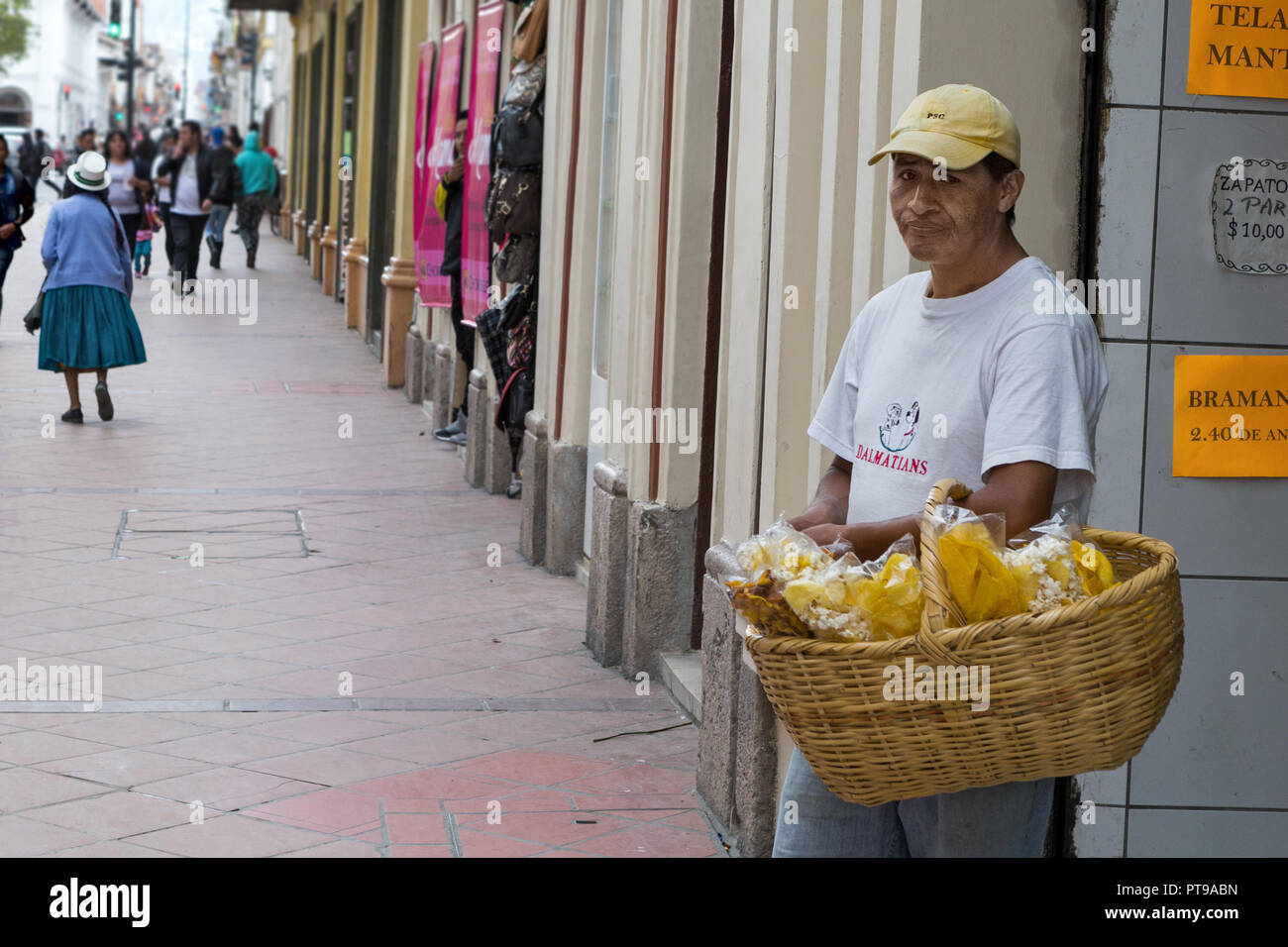Street seller selling popcorn & fried plantain, Cuenca, Ecuador Stock Photo