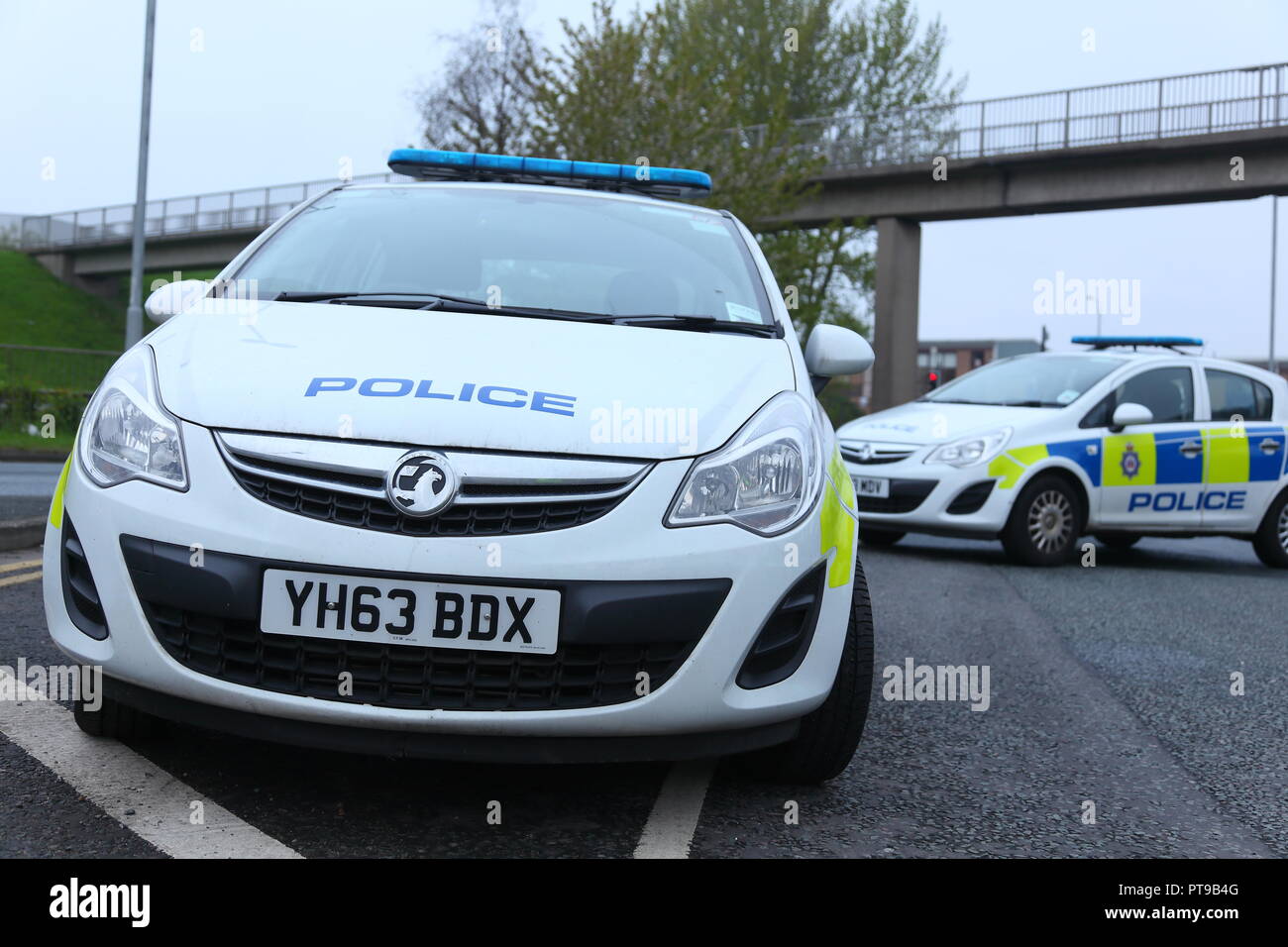Police vehicles create a road block at a fire incident in Armely, West Yorkshire. Stock Photo