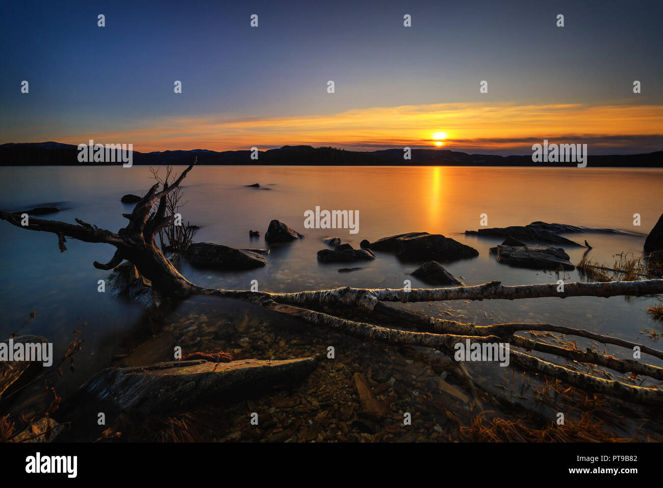 Sunset by the Jonsvatnet lake. Long exposure shot. Trondheim area, Norway. Stock Photo