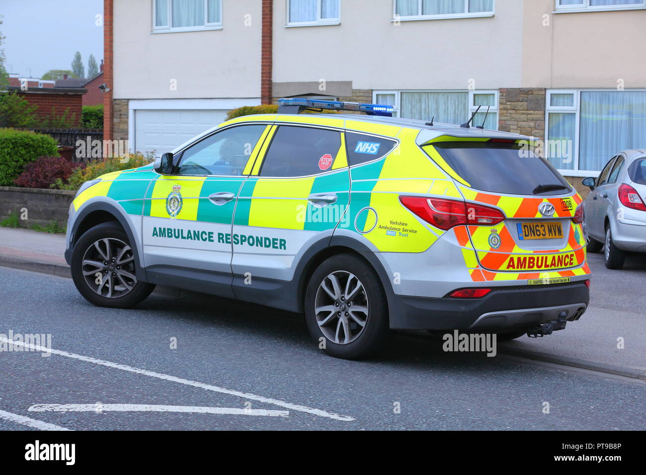 Emergency service vehicles at the scene of a fatal house fire in Garforth, Leeds, West Yorkshire