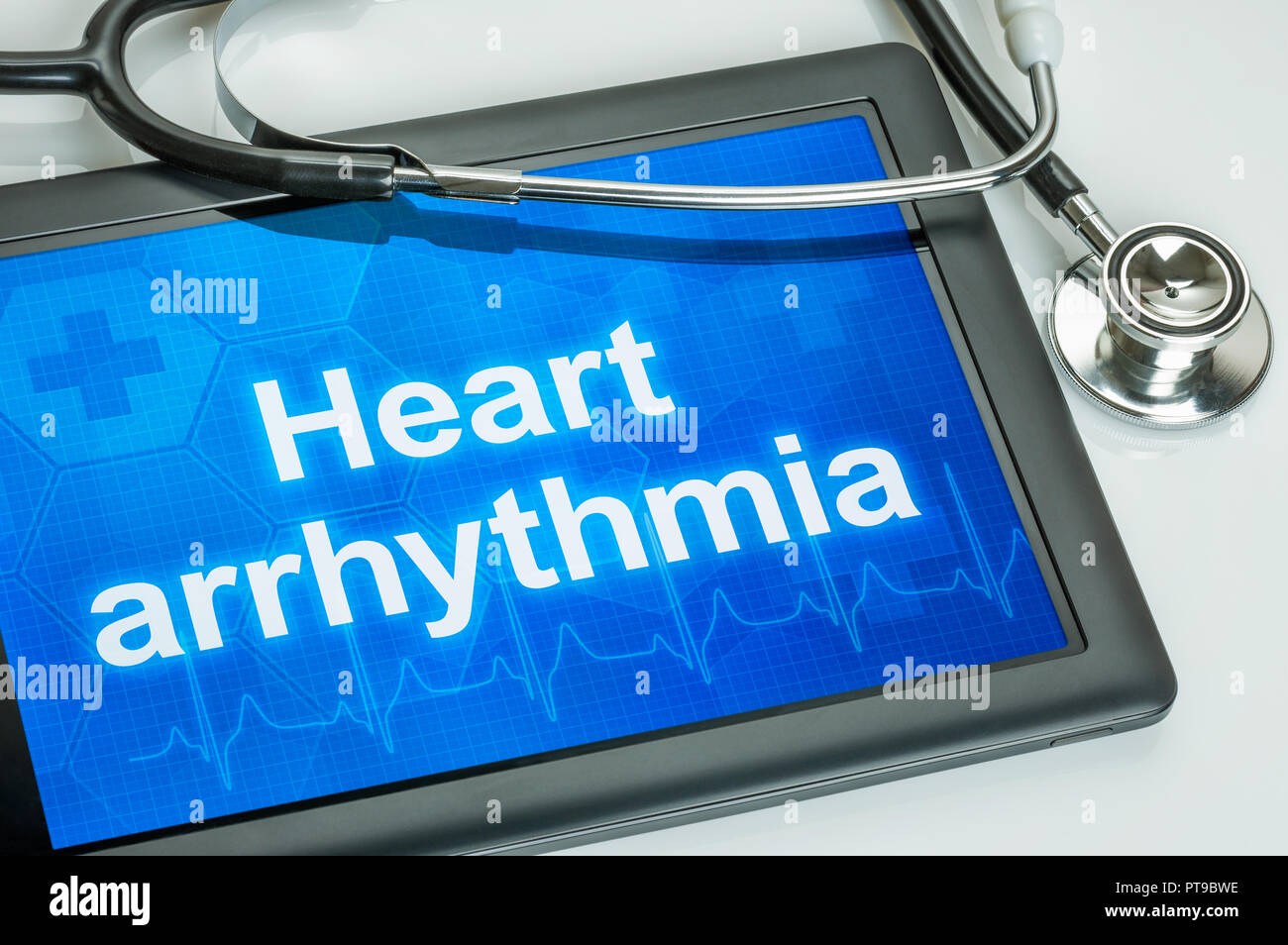 Tablet with the text Heart arrythmia the display Stock Photo
