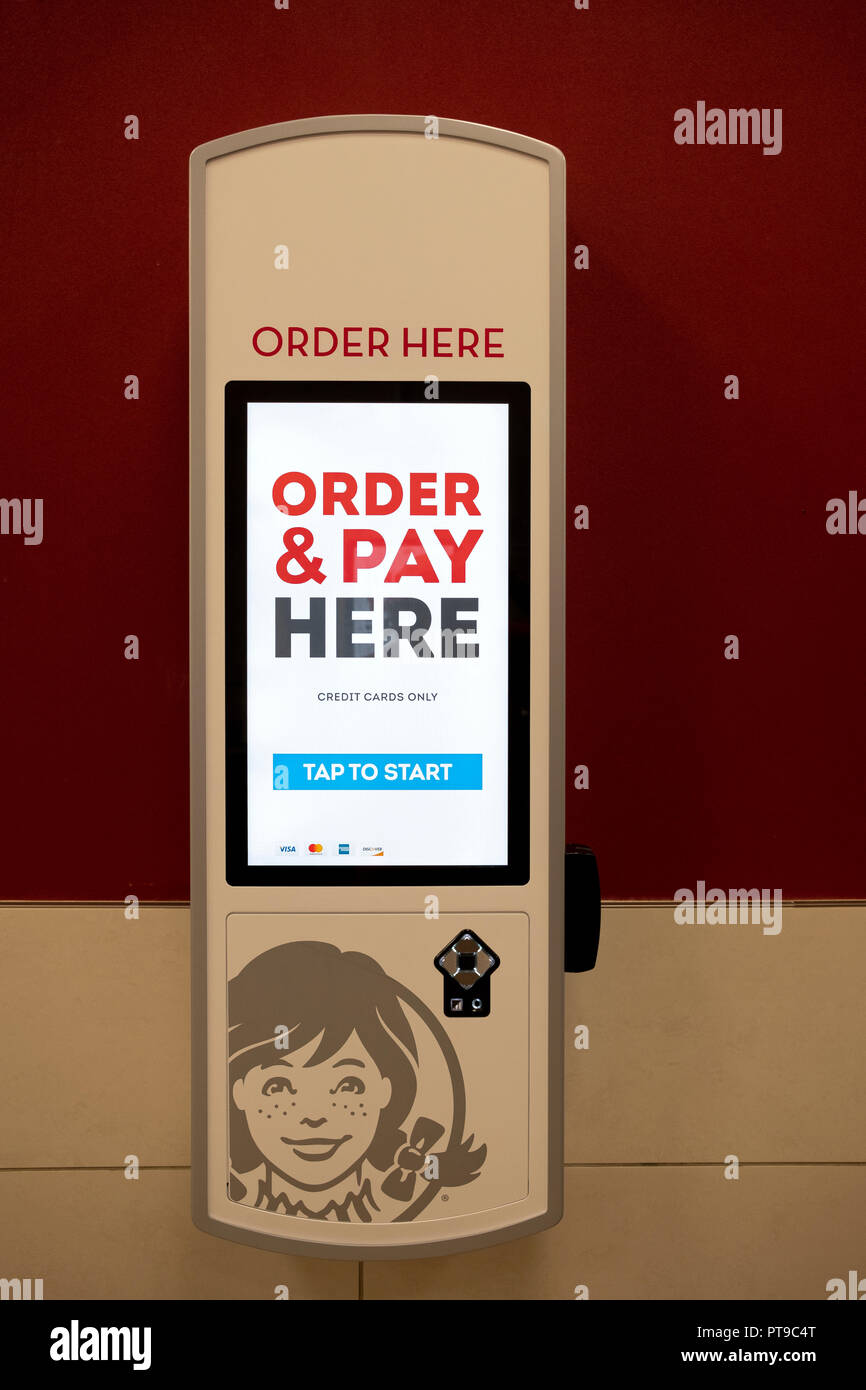 An ordering station at a Wendy's fast food restaurant that takes orders & payments thereby reducing labor costs. In Manhattan, New York City. Stock Photo