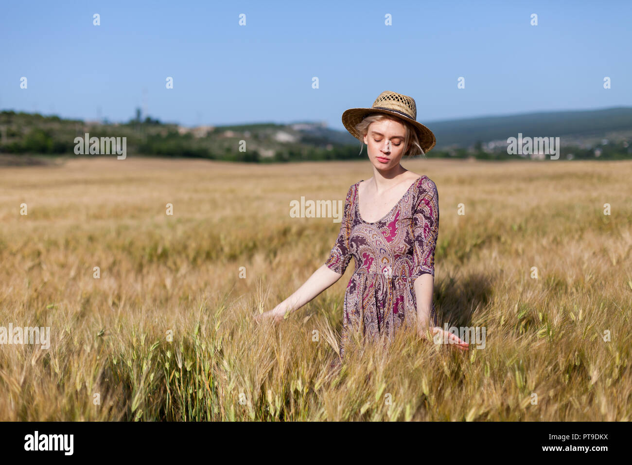 a woman farmer in field of wheat before the harvest Stock Photo - Alamy