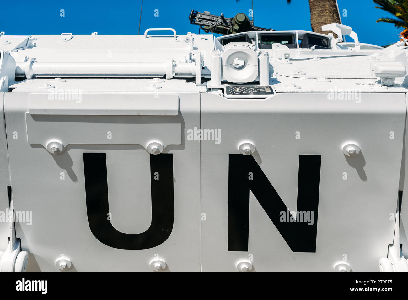 Close up of United Nations peacekeeping tank vehicle with machine gun mounted on top Stock Photo